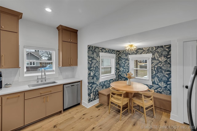 304 E Dallas St, Broken Arrow, OK 74012 - kitchen with wallpapered walls, dishwasher, light wood-style flooring, light countertops, and plenty of natural light