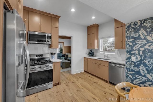 304 E Dallas St, Broken Arrow, OK 74012 - kitchen with appliances with stainless steel finishes, light countertops, light wood-style floors, tasteful backsplash, and recessed lighting