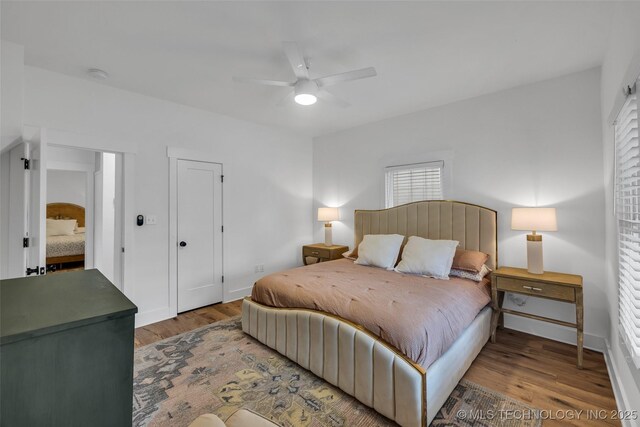 304 E Dallas St, Broken Arrow, OK 74012 - bedroom with wood finished floors and a ceiling fan