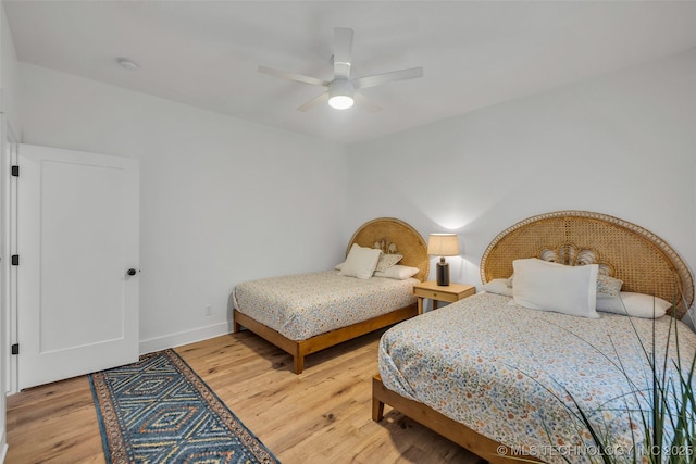 bedroom featuring ceiling fan and wood-type flooring