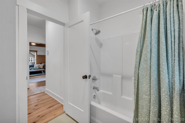 304 E Dallas St, Broken Arrow, OK 74012 - bathroom featuring wood finished floors and shower / tub combo
