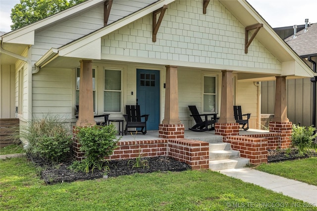 304 E Dallas St, Broken Arrow, OK 74012 - bungalow-style house featuring covered porch and a front lawn