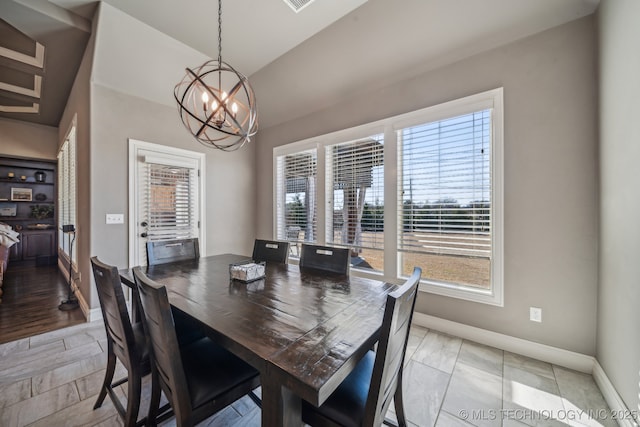 dining space featuring a chandelier