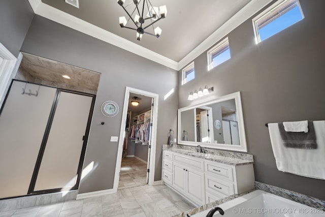 bathroom with an inviting chandelier, an enclosed shower, vanity, and ornamental molding