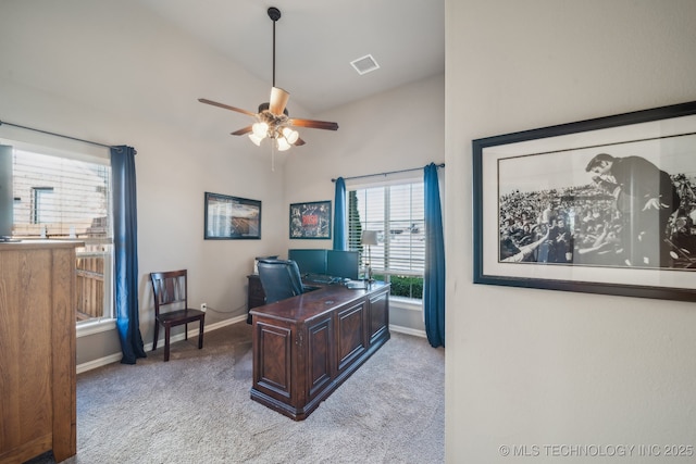 office with vaulted ceiling, light colored carpet, and ceiling fan