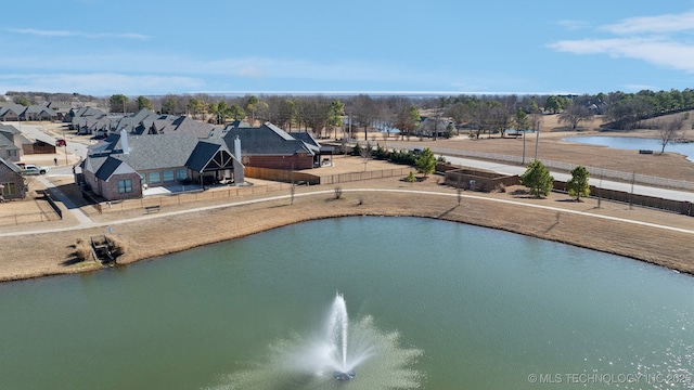 view of pool with a water view