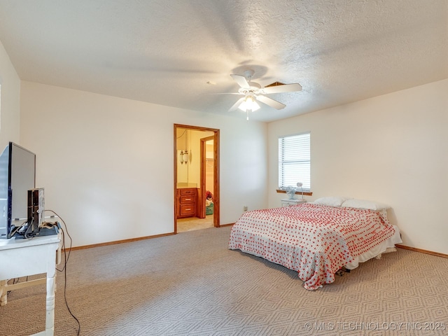 bedroom with light carpet, ceiling fan, connected bathroom, and a textured ceiling