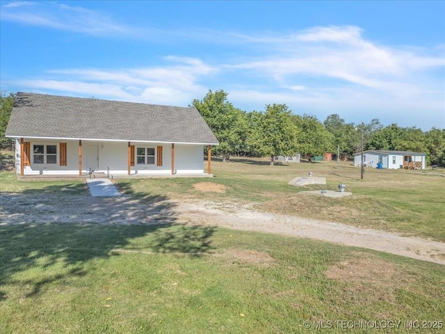 view of yard featuring covered porch