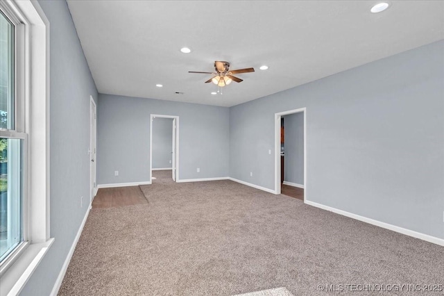 spare room with ceiling fan and carpet floors