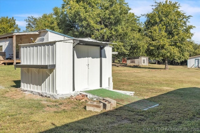 view of outdoor structure featuring a yard