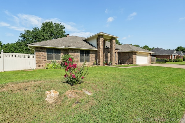 view of front of house with a garage and a front yard