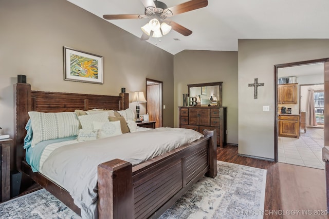 bedroom featuring hardwood / wood-style flooring, ceiling fan, and vaulted ceiling