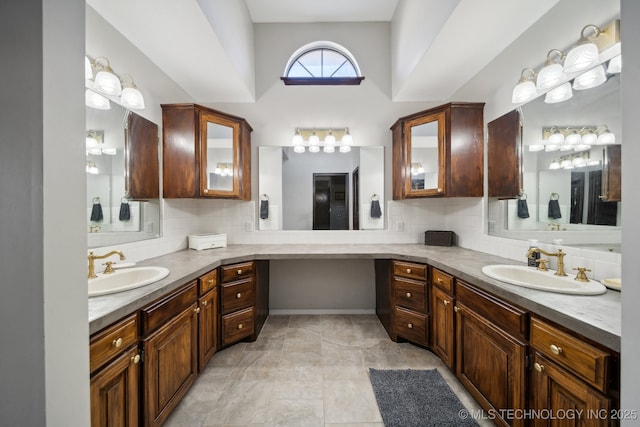 bathroom with vanity and decorative backsplash