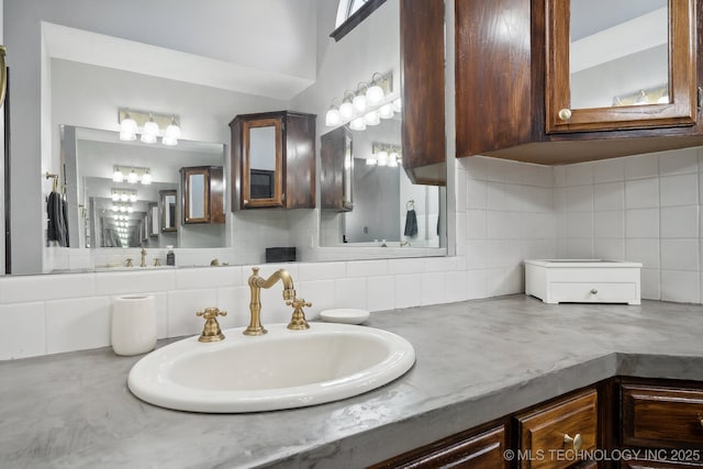 bathroom with vanity and backsplash