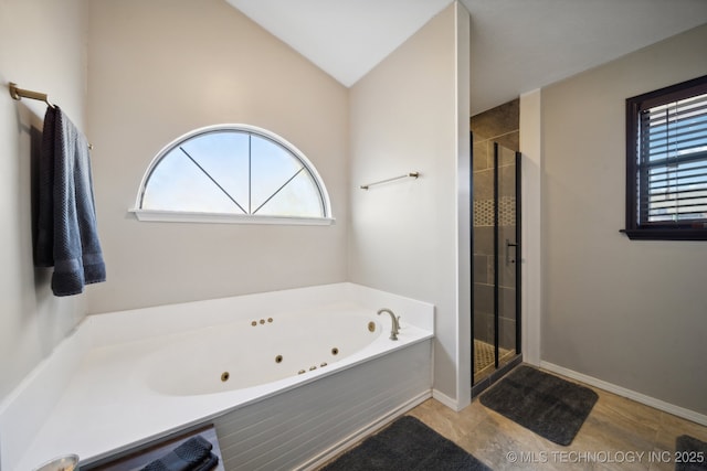 bathroom with plenty of natural light and independent shower and bath