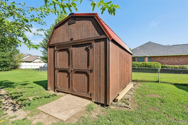 view of outdoor structure with a lawn