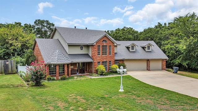 view of front facade featuring a garage and a front lawn