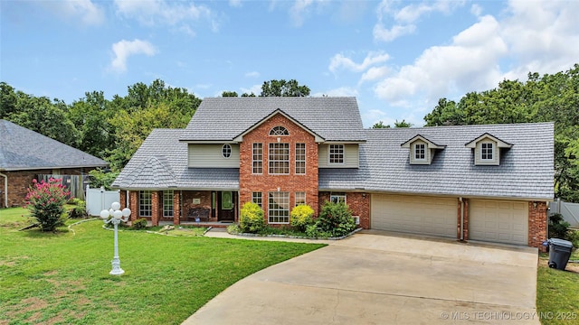 view of front facade with a garage and a front lawn