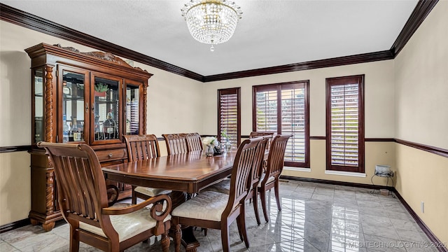 dining area with ornamental molding, a textured ceiling, and a chandelier