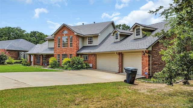 view of front of home with a garage and a front yard