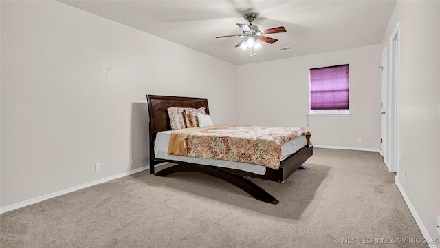 bedroom with light carpet and ceiling fan