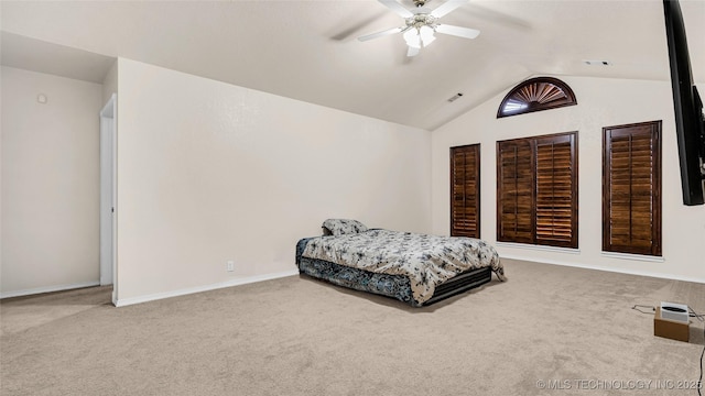 bedroom with carpet floors, ceiling fan, and vaulted ceiling