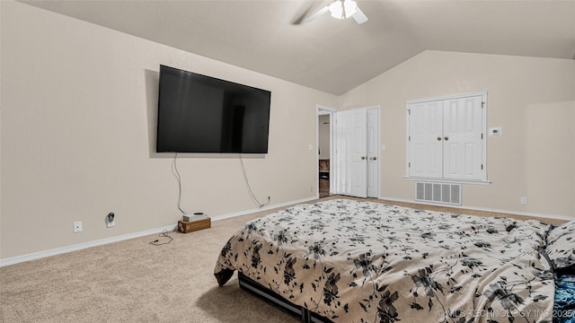 carpeted bedroom with vaulted ceiling and ceiling fan