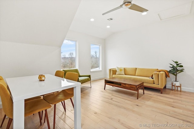 interior space with ceiling fan, light hardwood / wood-style floors, and vaulted ceiling