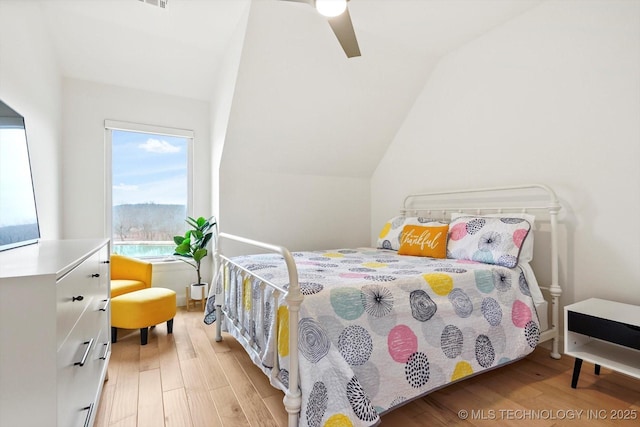 bedroom featuring vaulted ceiling, ceiling fan, and light hardwood / wood-style floors