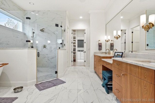 bathroom featuring ornamental molding, vanity, and a shower with shower door