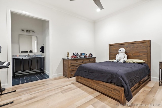 bedroom with crown molding, wood-type flooring, ensuite bath, and ceiling fan