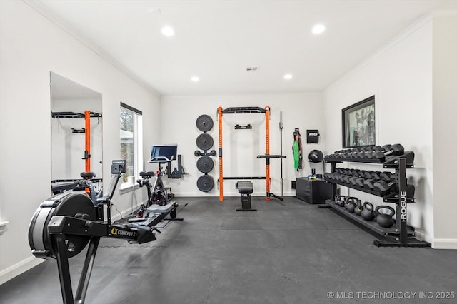 exercise area featuring crown molding