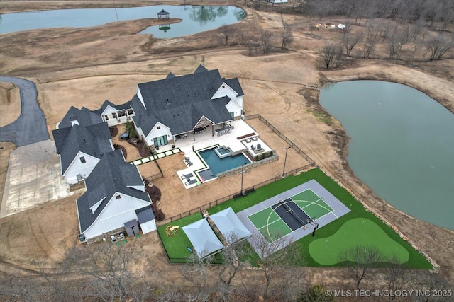 drone / aerial view with a water view