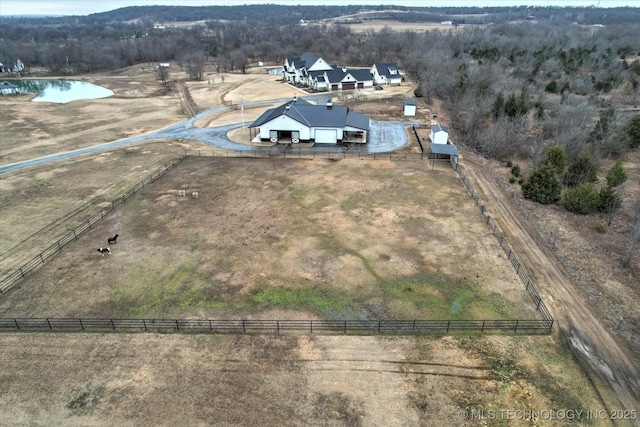 bird's eye view featuring a water view and a rural view