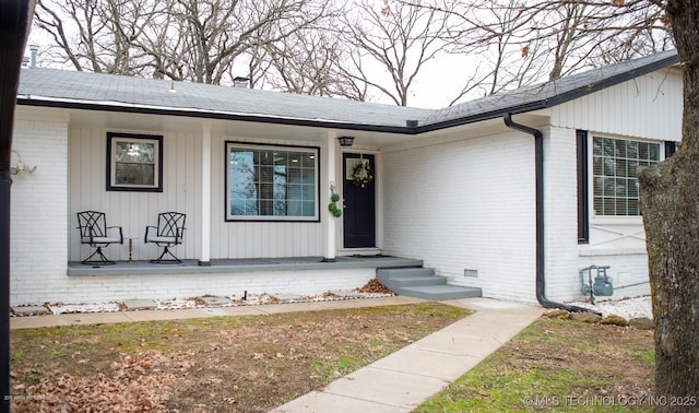 doorway to property featuring covered porch