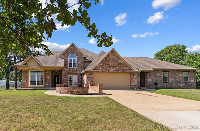 view of front of home with a garage and a front yard