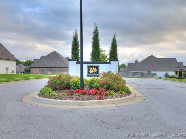 community / neighborhood sign with driveway