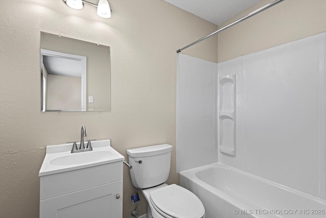 full bathroom with vanity, a textured ceiling, shower / tub combination, and toilet