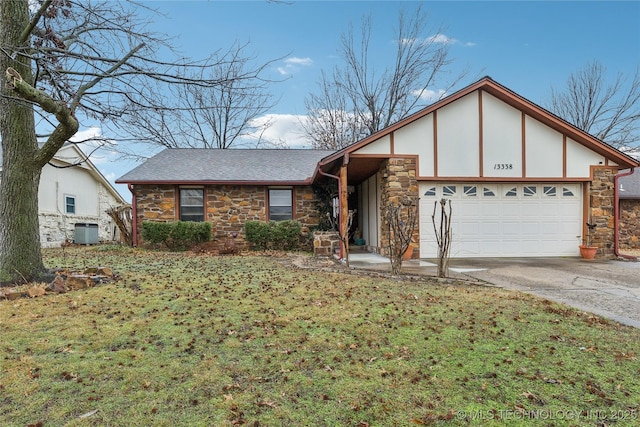 view of front of property featuring a garage and a front yard