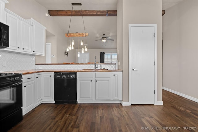 kitchen featuring white cabinetry, sink, decorative light fixtures, and black appliances