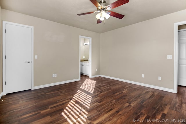 unfurnished bedroom featuring dark hardwood / wood-style floors, connected bathroom, and ceiling fan