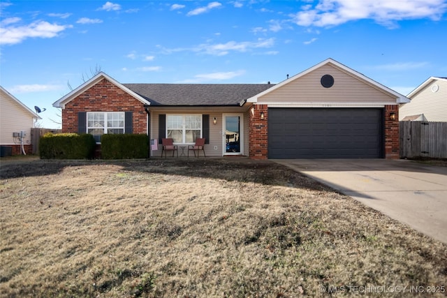 single story home featuring a garage and a front lawn