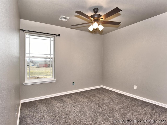 spare room featuring carpet and ceiling fan