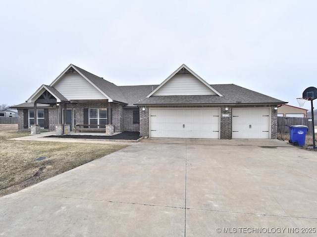 view of front of house featuring a garage and a front lawn