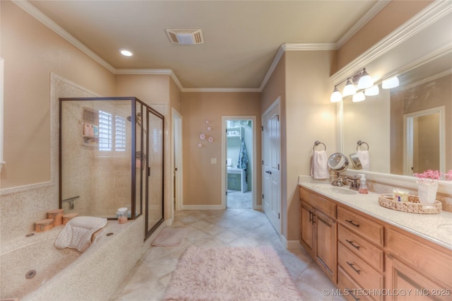 bathroom featuring tile patterned flooring, crown molding, vanity, and a shower with shower door