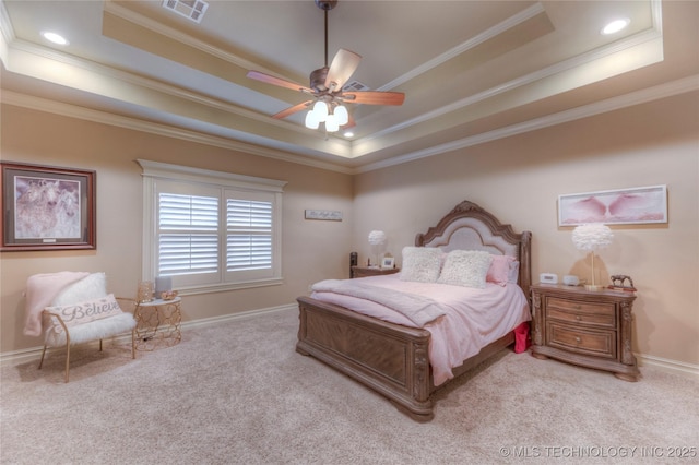 bedroom featuring a tray ceiling, ornamental molding, and light colored carpet