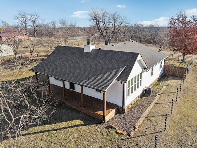 back of house featuring central AC