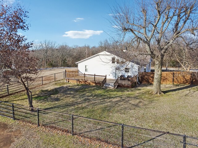 view of yard featuring a deck and a rural view