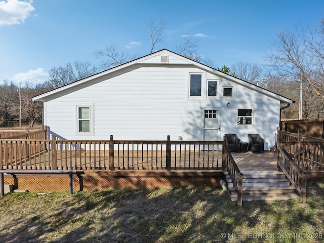 rear view of property with a deck