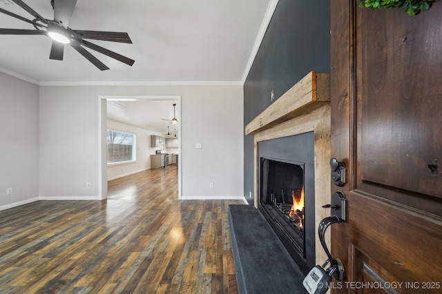 living room featuring ornamental molding, dark hardwood / wood-style floors, and ceiling fan